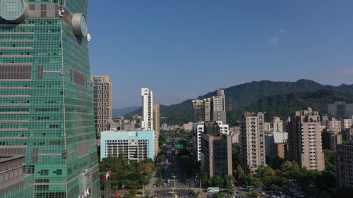 Modern buildings in city against clear sky