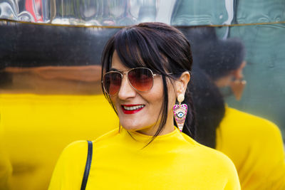 Portrait of smiling woman with sunglasses
