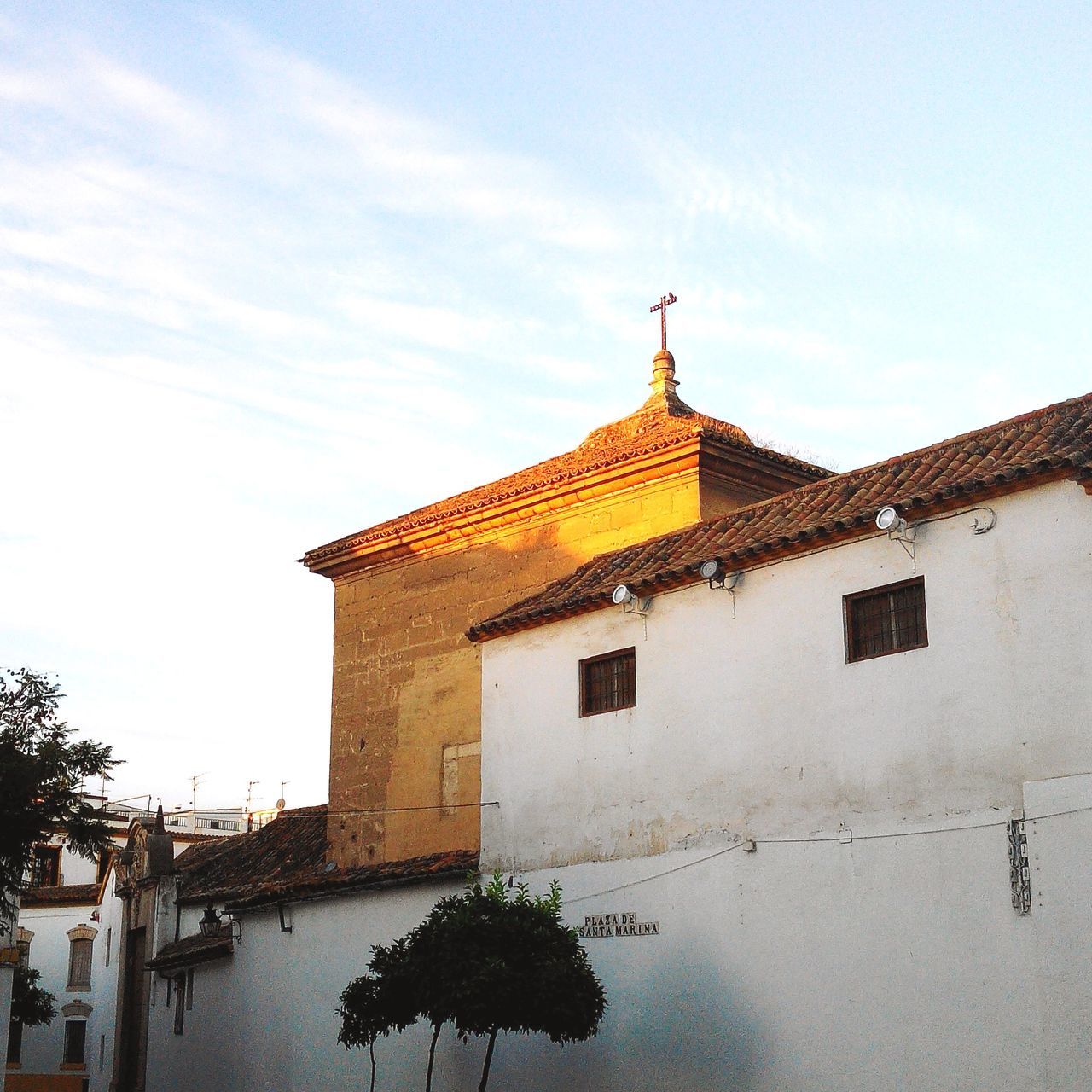 architecture, building exterior, built structure, house, sky, residential structure, roof, religion, tree, place of worship, residential building, low angle view, spirituality, church, cloud - sky, outdoors, day, cloud, no people, window