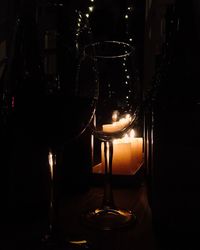 Close-up of illuminated lamp on table