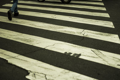 Shadow of zebra crossing on road