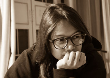 Portrait of woman with eyeglasses at home