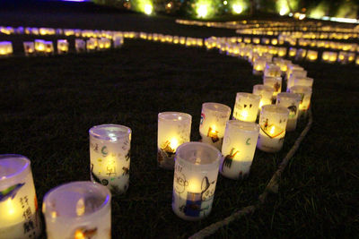 Row of illuminated lights at night