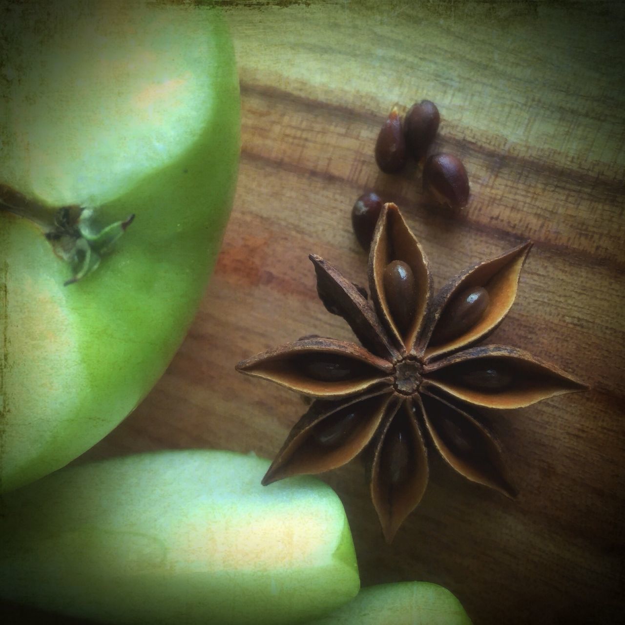 indoors, table, close-up, freshness, still life, high angle view, leaf, green color, healthy eating, food and drink, vegetable, home interior, no people, fruit, stem, wood - material, fragility, food, nature, vase