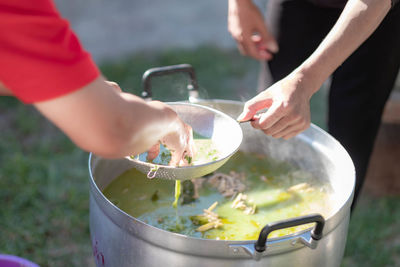 Midsection of woman preparing food