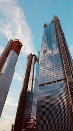 Low angle view of modern buildings against sky