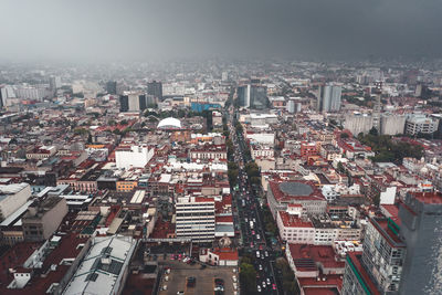 High angle view of buildings in city against sky