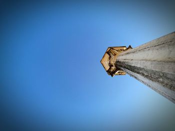 Low angle view of built structure against clear blue sky