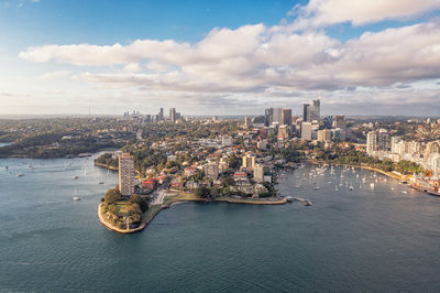 Aerial view of modern skyscrapers and buildings near port on cloudy day. travels sydney, australia.