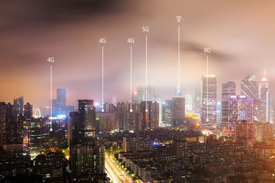 Illuminated buildings in city at night