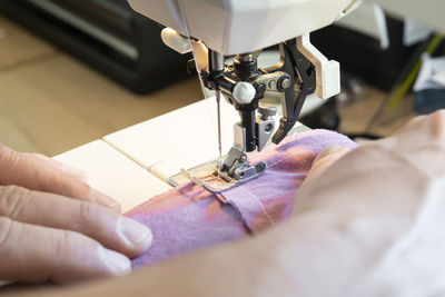 Close up of using a sewing machine