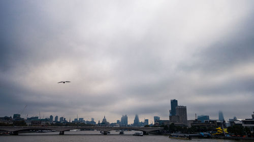 View of city against cloudy sky