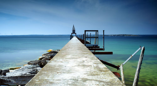 Pier over sea against clear sky