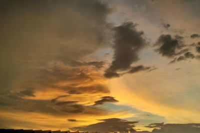 Low angle view of dramatic sky during sunset