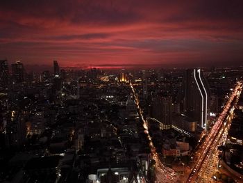 Aerial view of city lit up at night