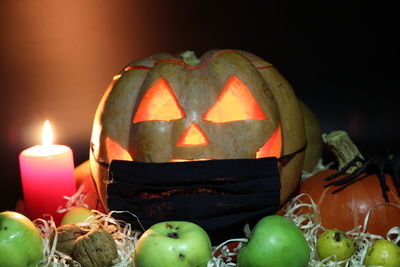 Close-up of illuminated pumpkin against black background