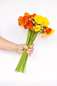 Close-up of woman holding flower