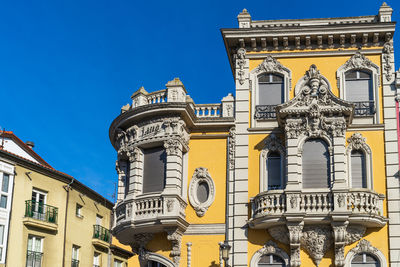 Low angle view of building against blue sky