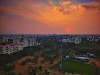 High angle view of buildings against sky during sunset