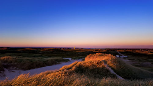 Scenic view of sea against sky at sunset