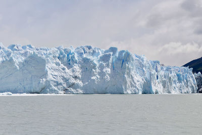 Scenic view of glacier against sky