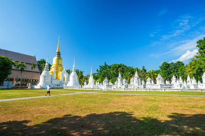 View of temple against building