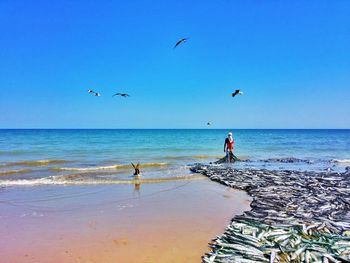 Scenic view of sea against blue sky