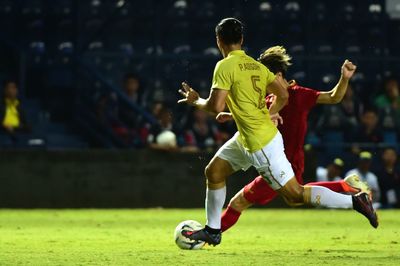 Man playing soccer on field