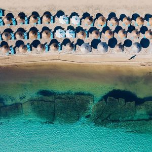 Aerial view of umbrellas at beach on sunny day