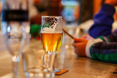 Close-up of beer glass on table