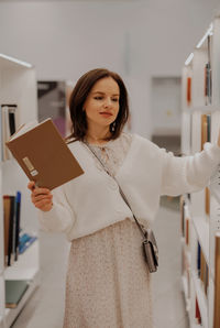 Portrait of young woman using digital tablet