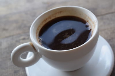 Close-up of coffee cup on table