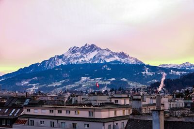 High angle view of townscape and mountains against sky