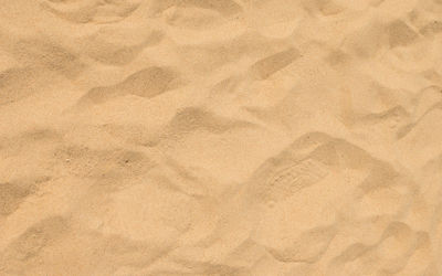 High angle view of paper on sand