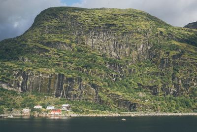 Scenic view of mountain by sea