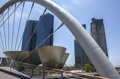 Bridge over river against tri-bowl at songo central park