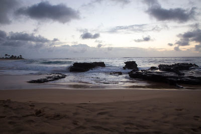 Scenic view of beach against sky