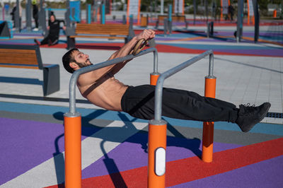 Low section of man exercising in gym