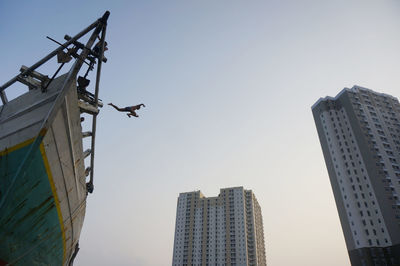 Low angle view of buildings against clear sky