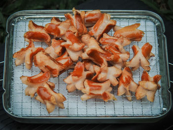 High angle view of meat on barbecue grill