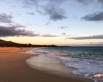 Scenic view of beach against sky during sunset