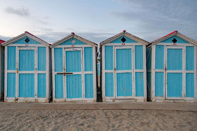 Beach huts against sky