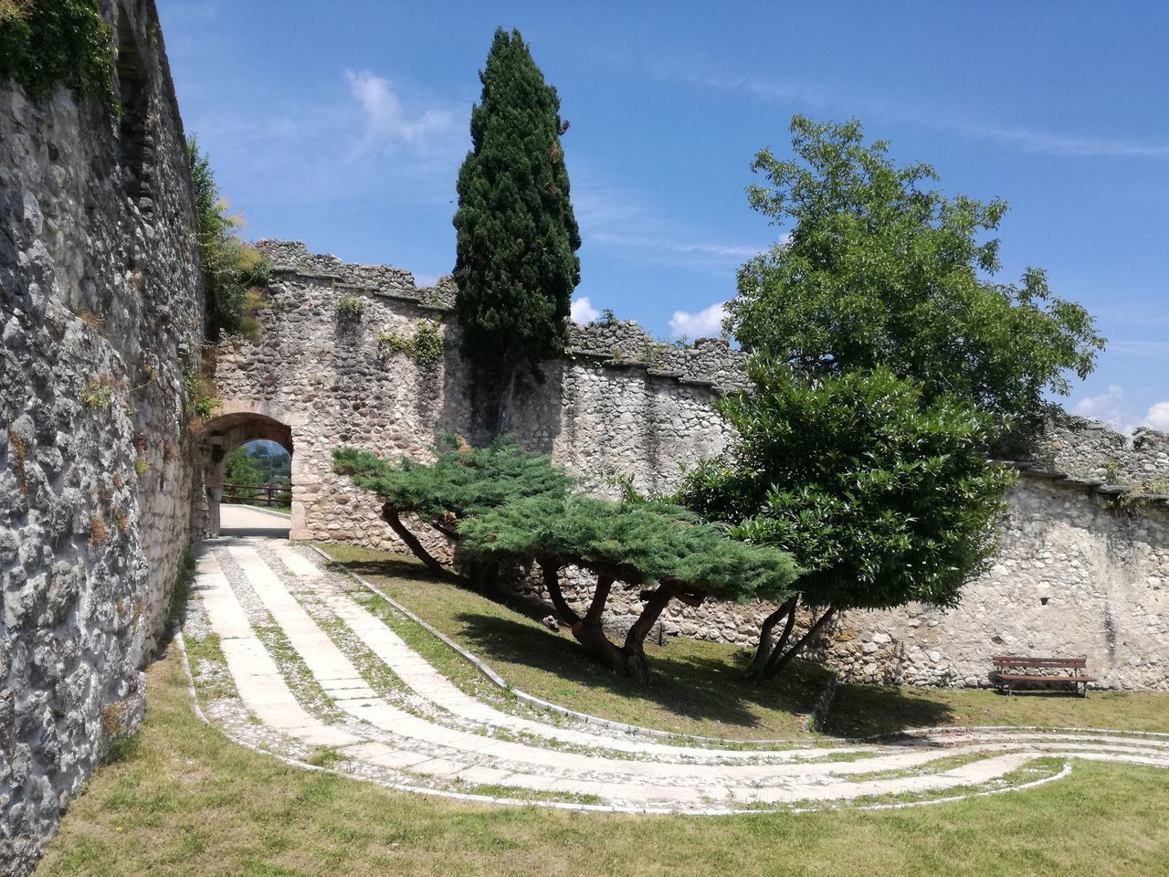 VIEW OF A BUILDING WITH TREES IN BACKGROUND