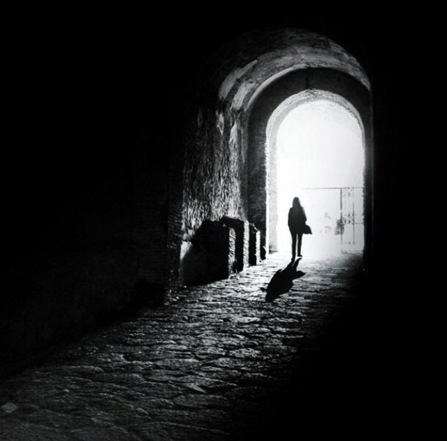 full length, walking, tunnel, indoors, silhouette, the way forward, arch, rear view, architecture, men, built structure, lifestyles, corridor, dark, archway, leisure activity, person