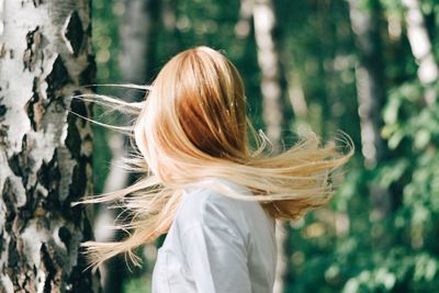 Rear view of woman with flying hair 