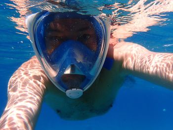 Portrait of man swimming in sea