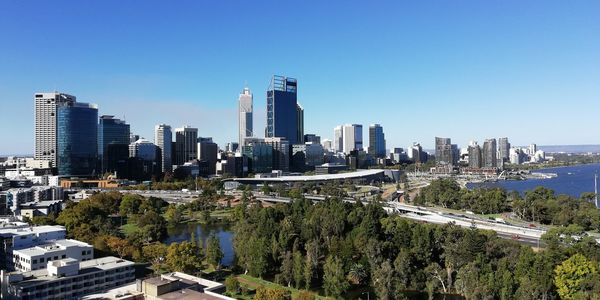 Modern buildings in city against clear sky
