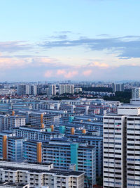 High angle view of buildings in city against sky