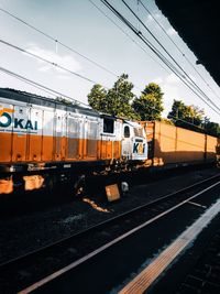 Train on railroad tracks against sky