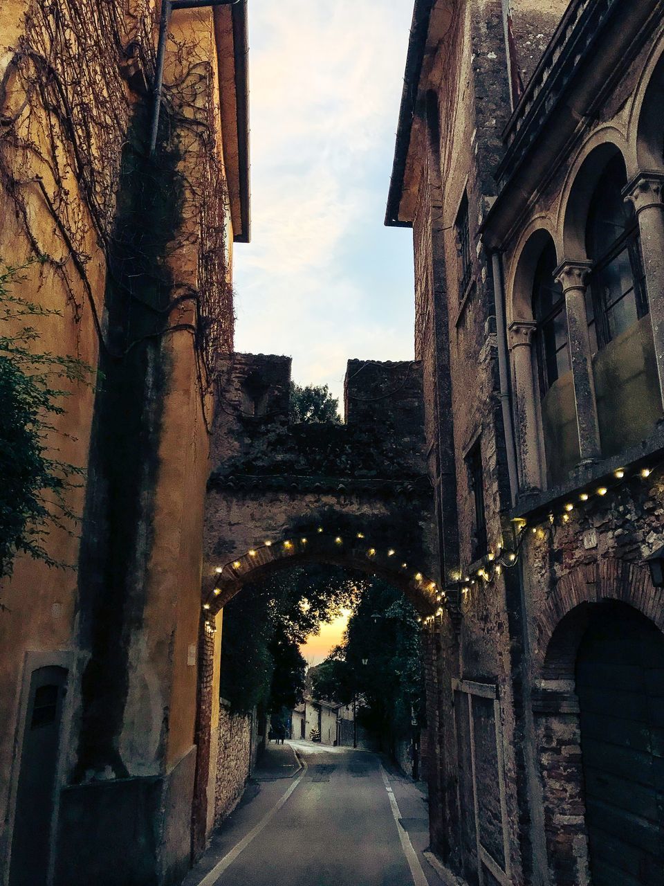 ARCHWAY AMIDST BUILDINGS